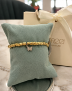 Bracciale con pepite e farfalla